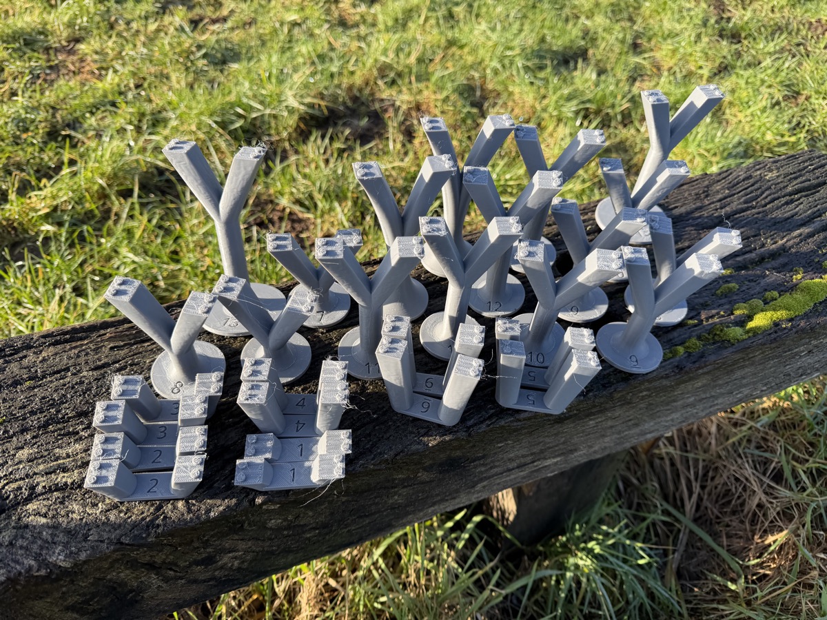 A batch of grey 3D printed model railway details